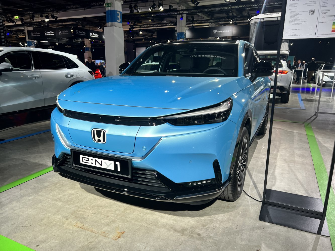 Modern electric SUV front with sleek LED headlights and aerodynamic design