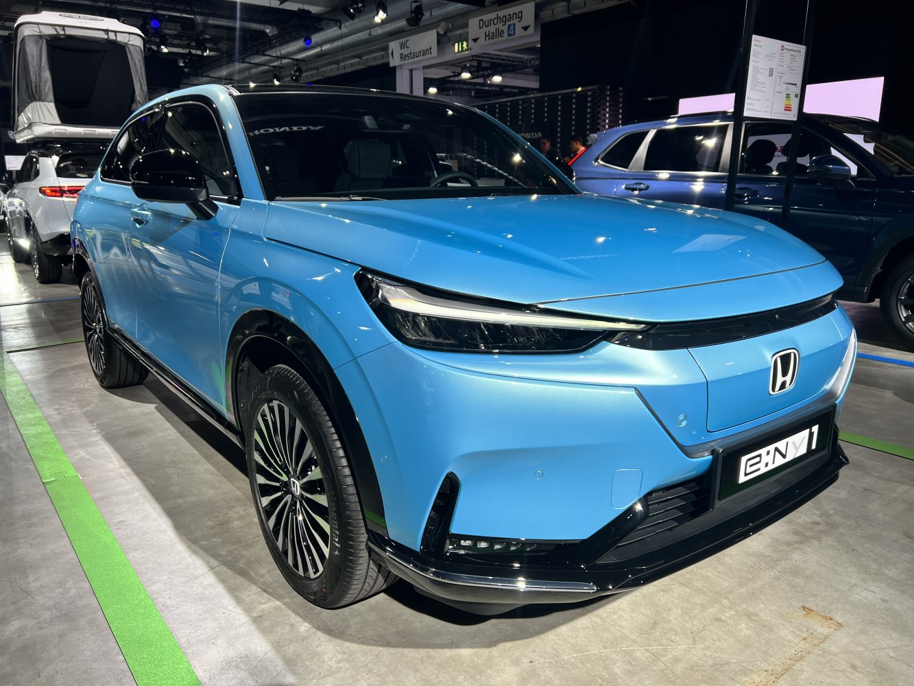 Compact electric SUV with sleek LED headlights and multi-spoke alloy wheels