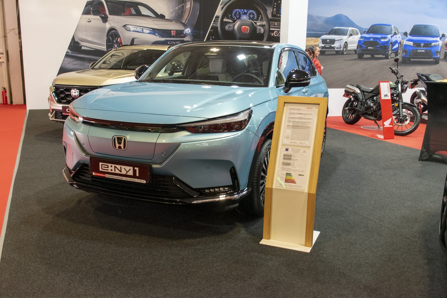 Front view of electric hatchback with sleek headlights and smooth design