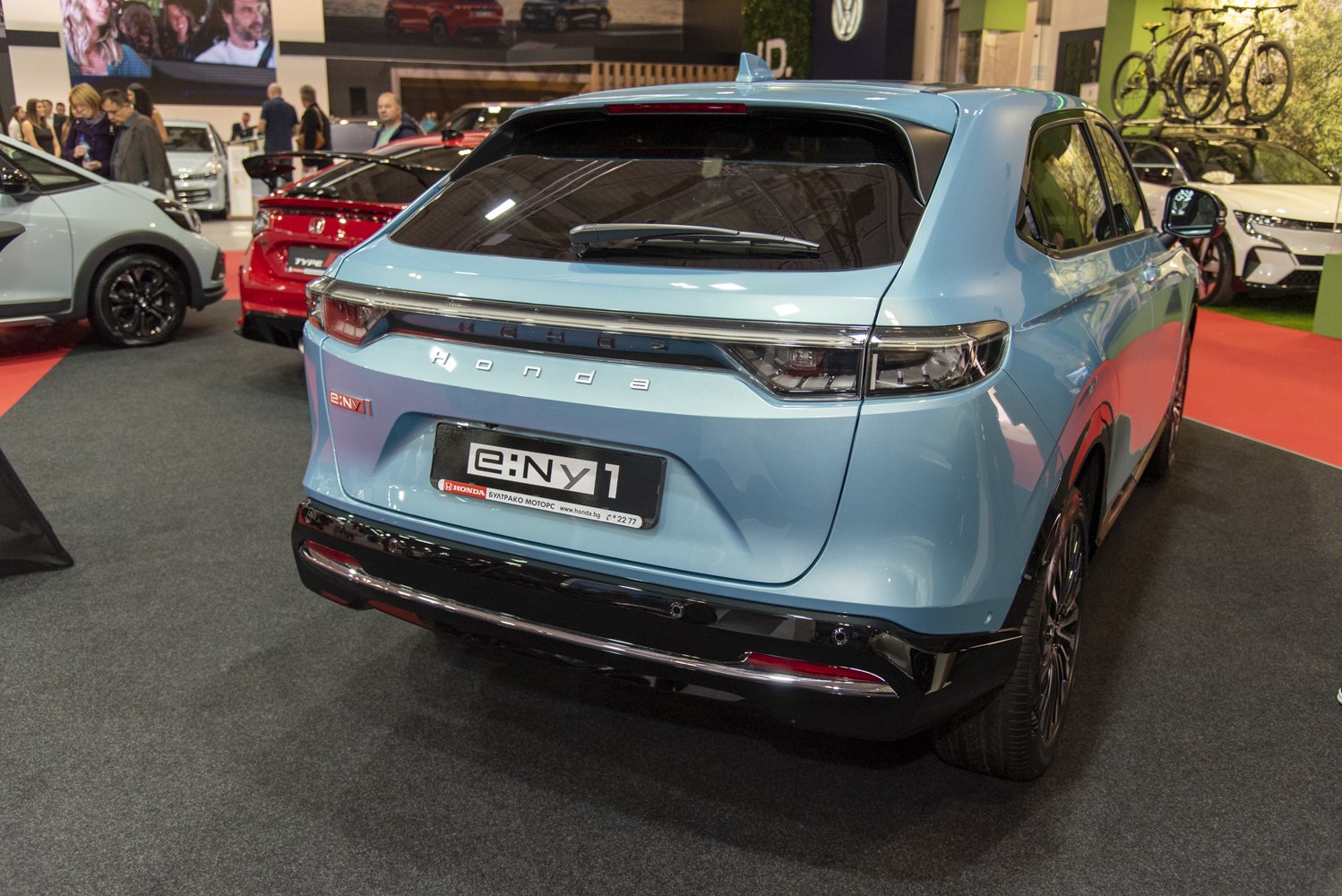 Rear view of modern electric SUV with sleek taillights and rear window wiper