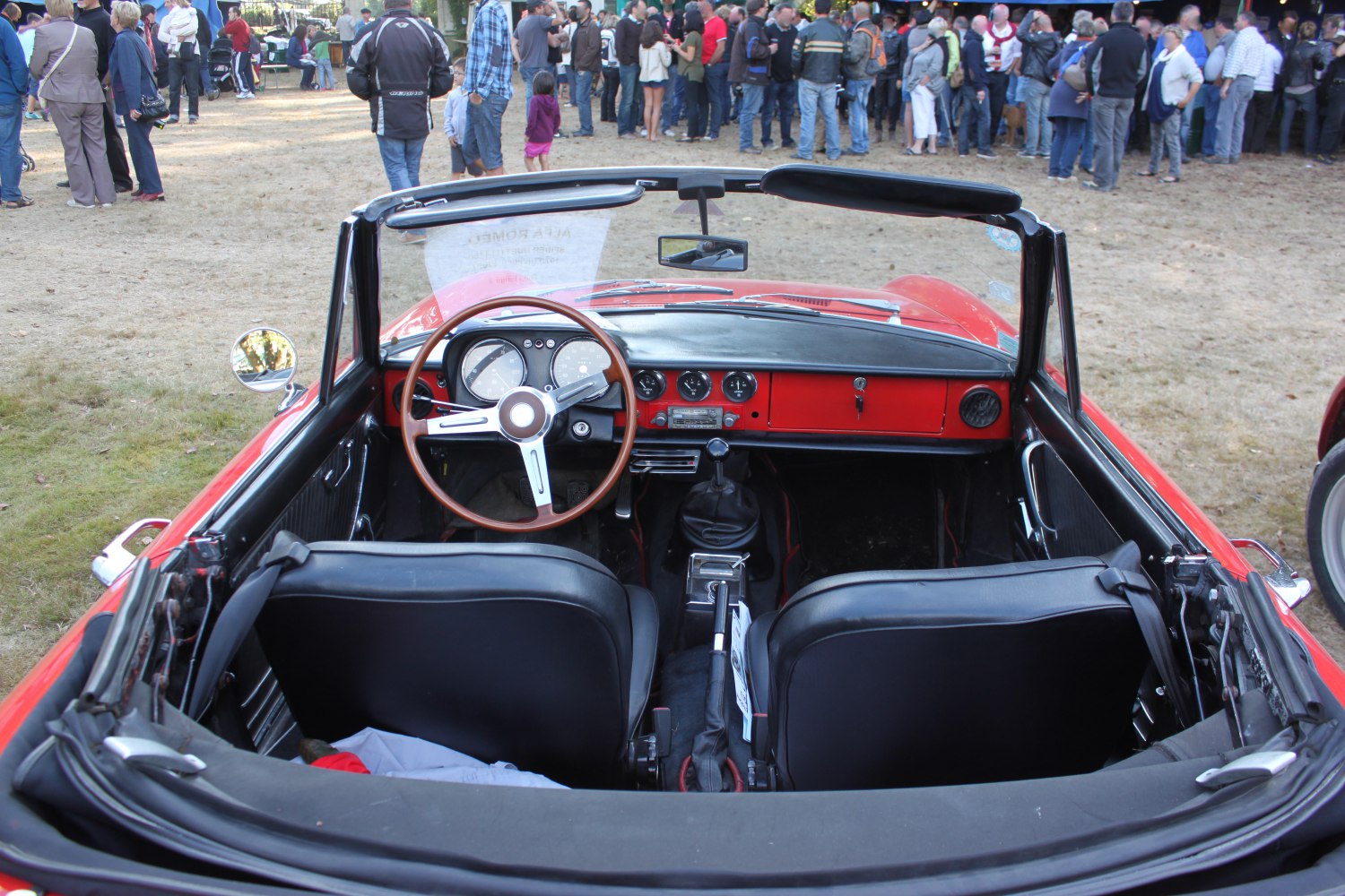 Convertible interior and dashboard with vintage steering wheel and instrumentation