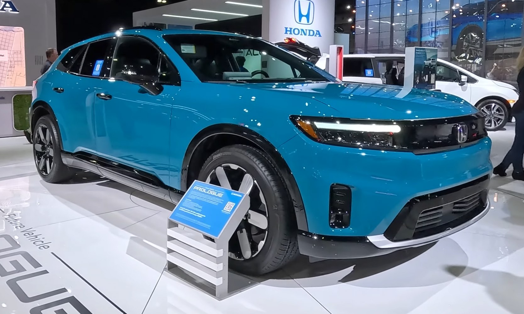 Electric SUV front view with LED headlights and modern wheels