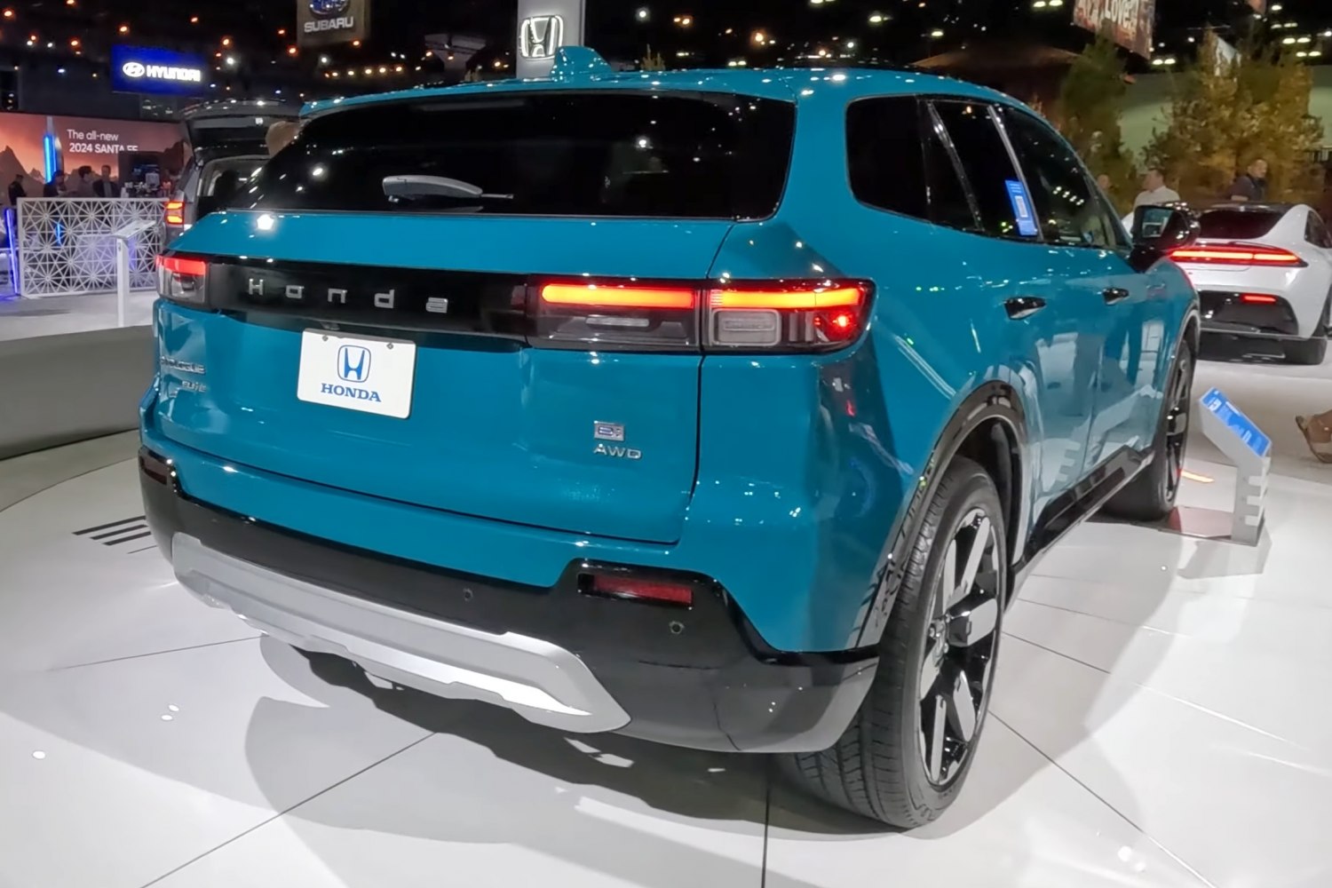 Rear view with LED tail lights and AWD badge on blue SUV