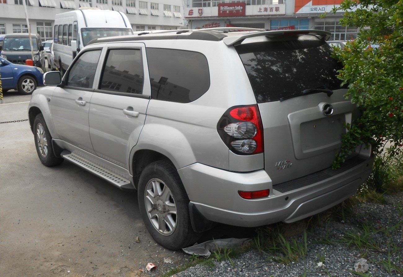 Rear side view of SUV with tinted windows and tail lights