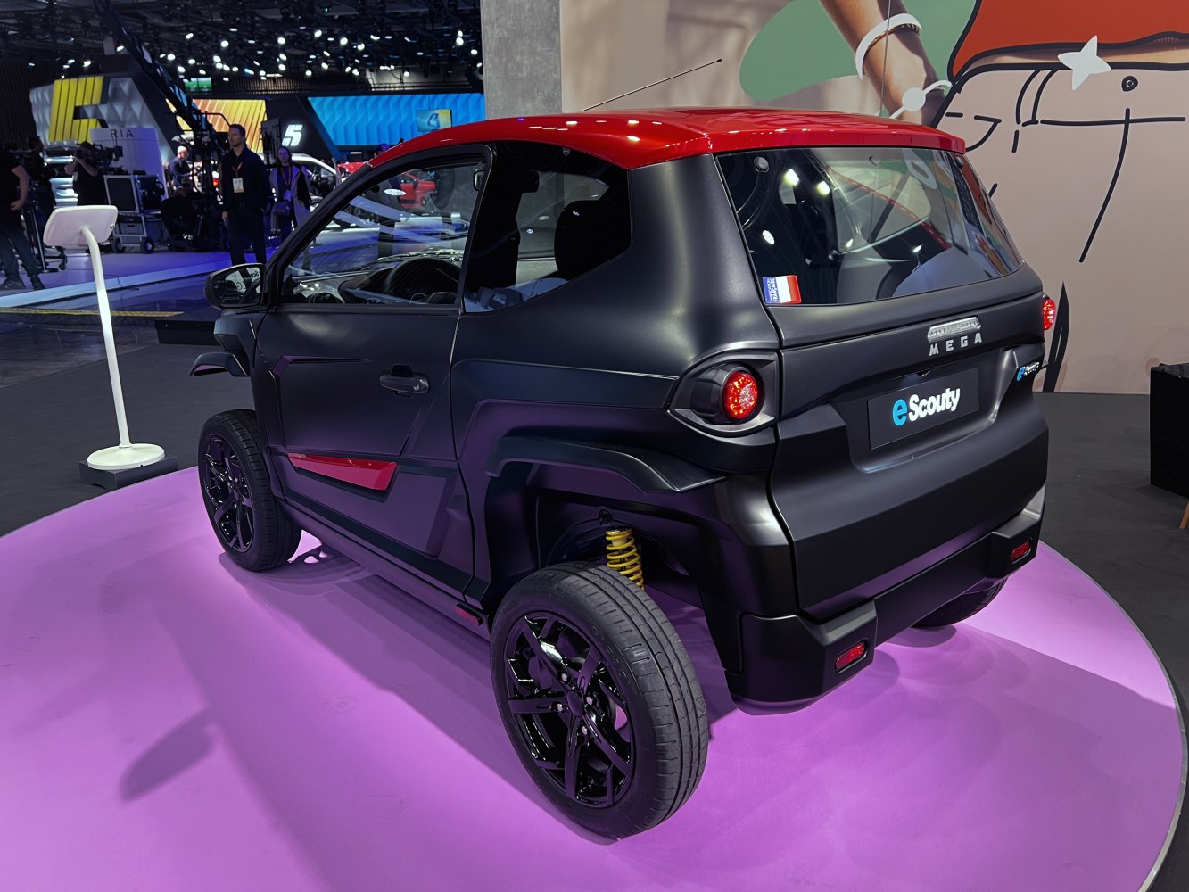 Rear view and unique suspension of a compact electric urban vehicle