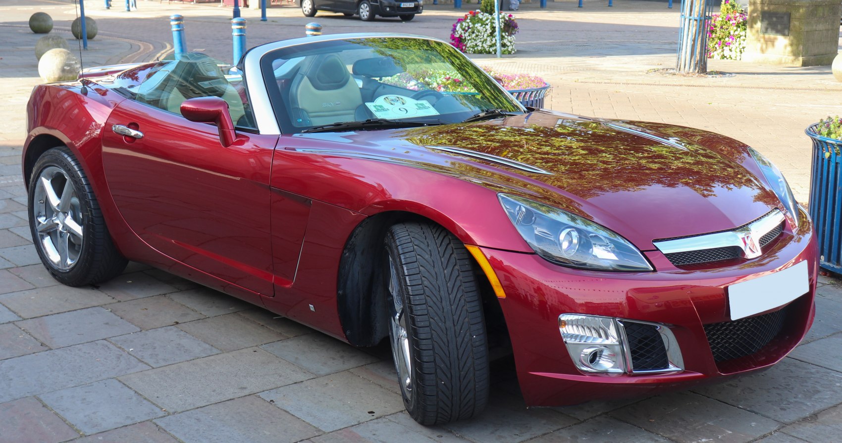 Convertible sports car front-side view with sporty headlights