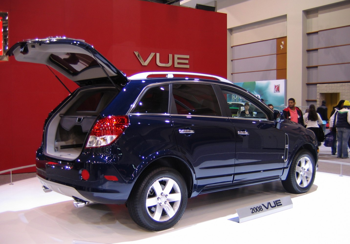 Open rear hatch and side profile of a 2008 SUV with five doors