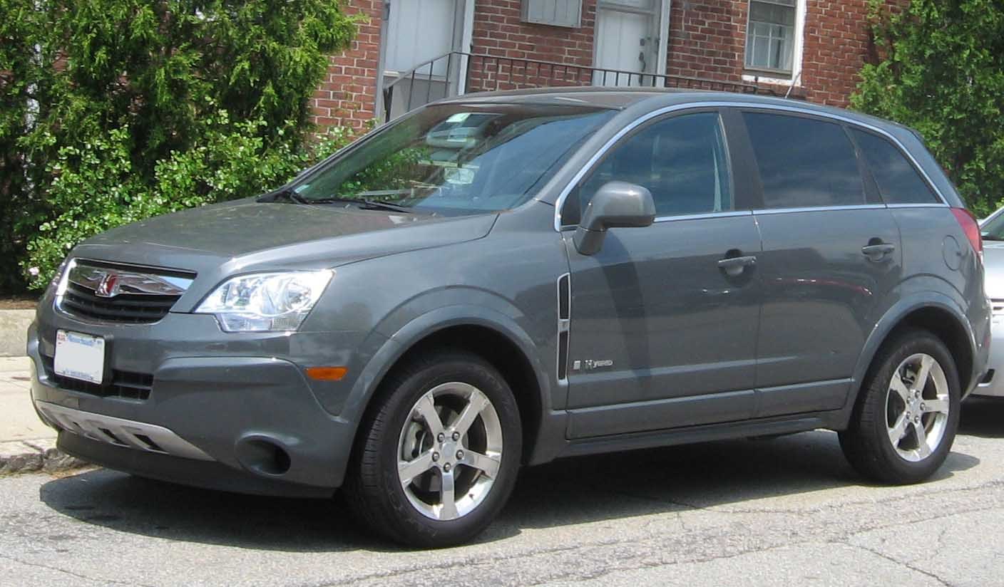 Gray SUV front-side profile, chrome rims, 5-spoke wheels
