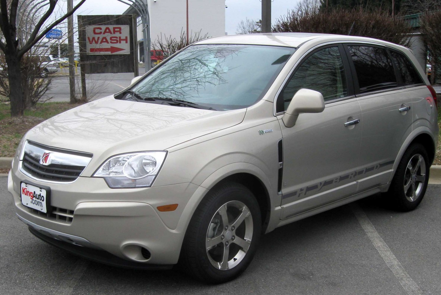 Front-side view of hybrid SUV with hybrid badge and alloy wheels