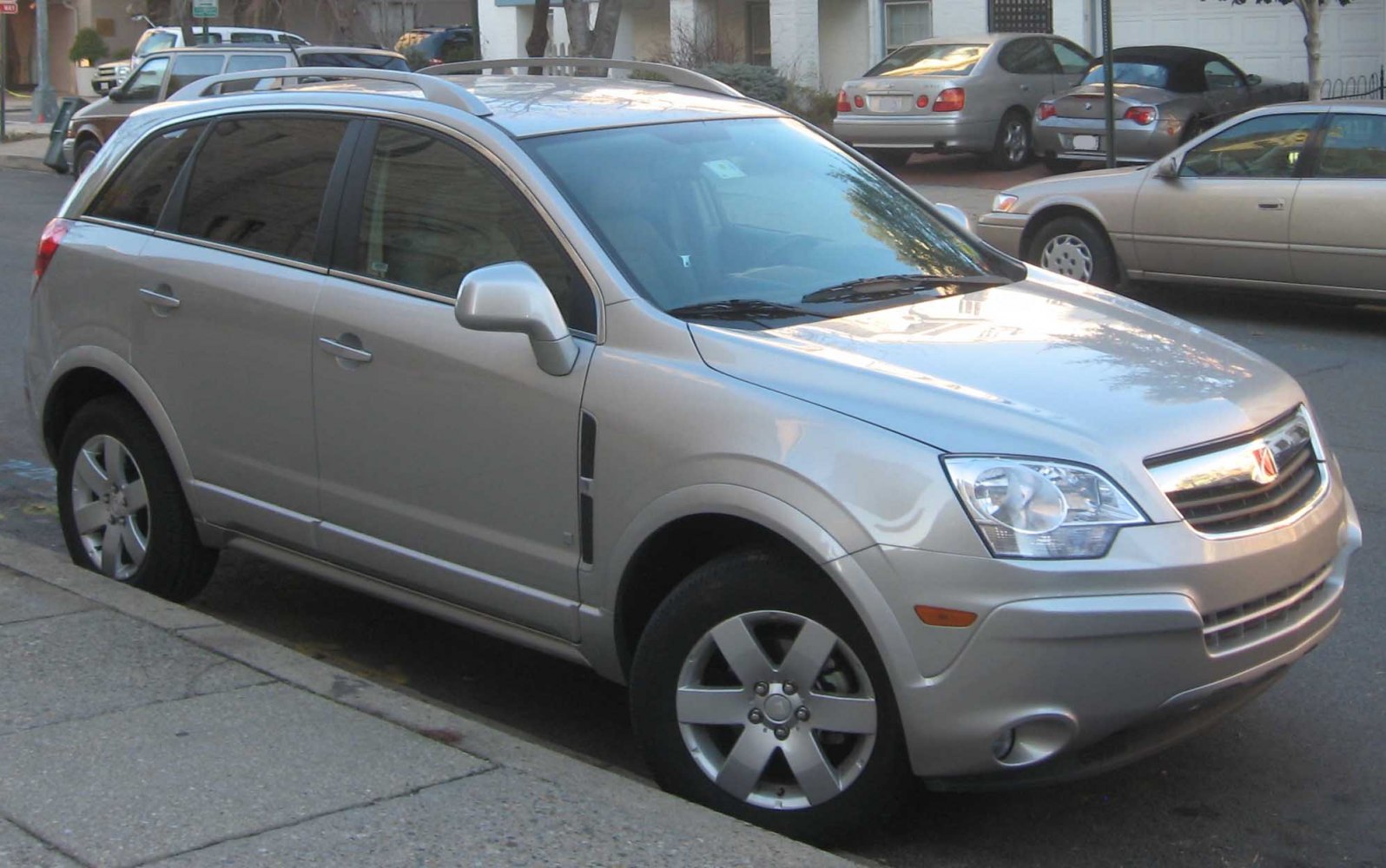 Silver SUV front side with alloy wheels and roof rails