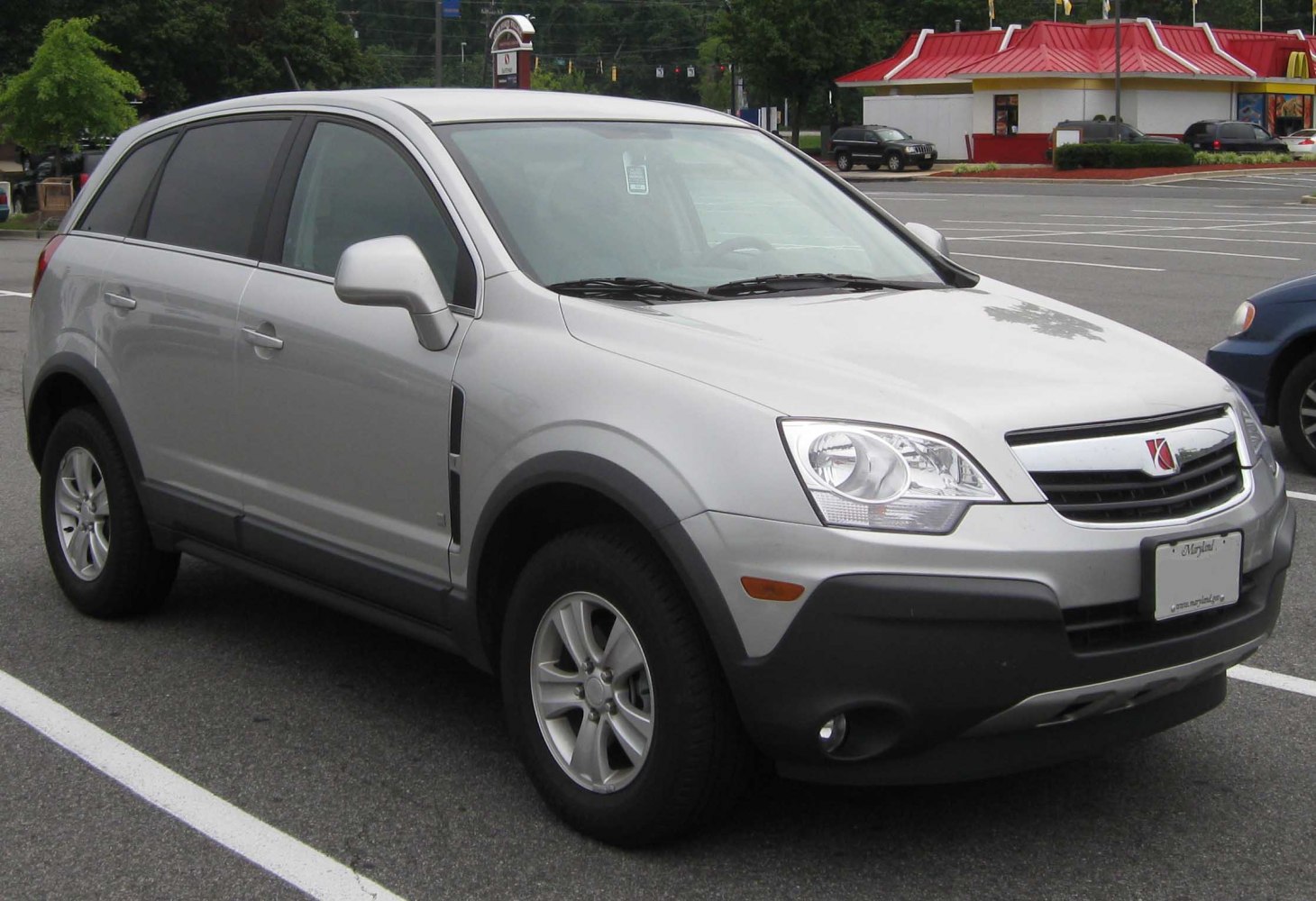 Silver SUV with black lower bumper and alloy wheels