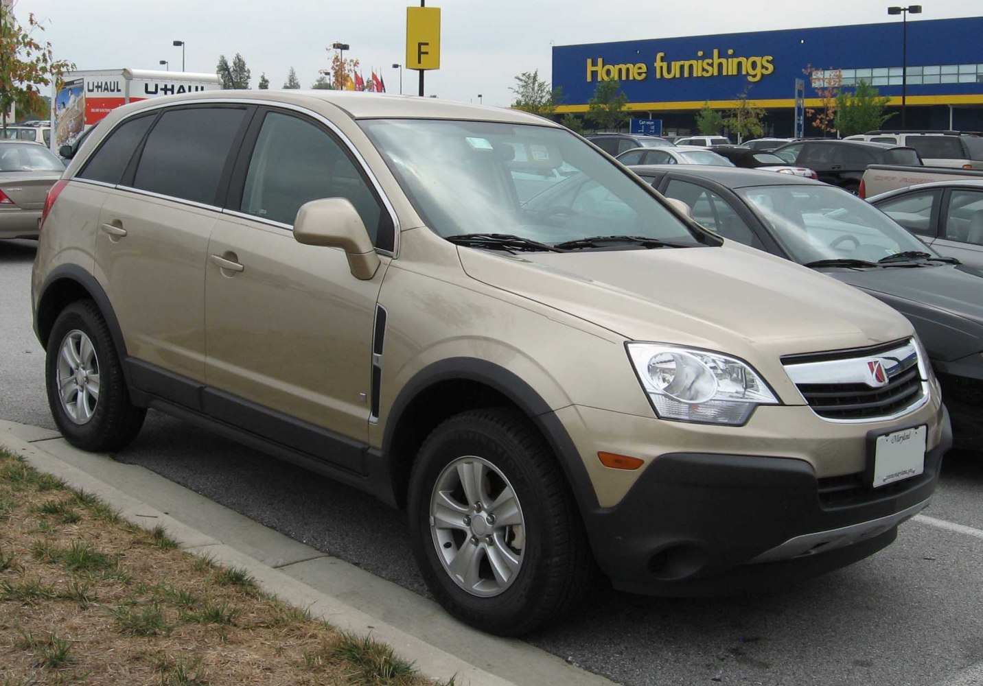 Front-side view of compact SUV with alloy wheels and beige paint