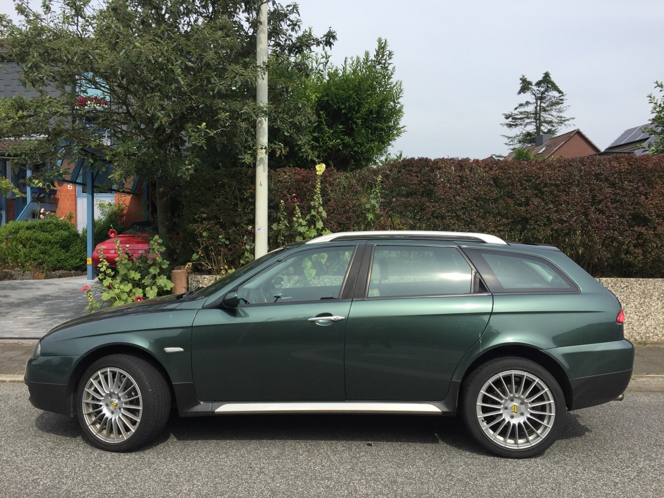 Side profile of estate with alloy wheels and sleek design lines