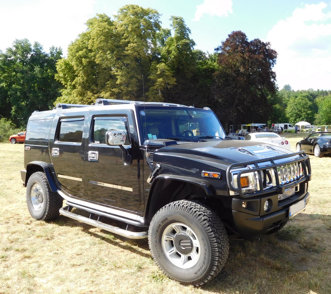 Black SUV with grille guard, chrome accents, and off-road tires