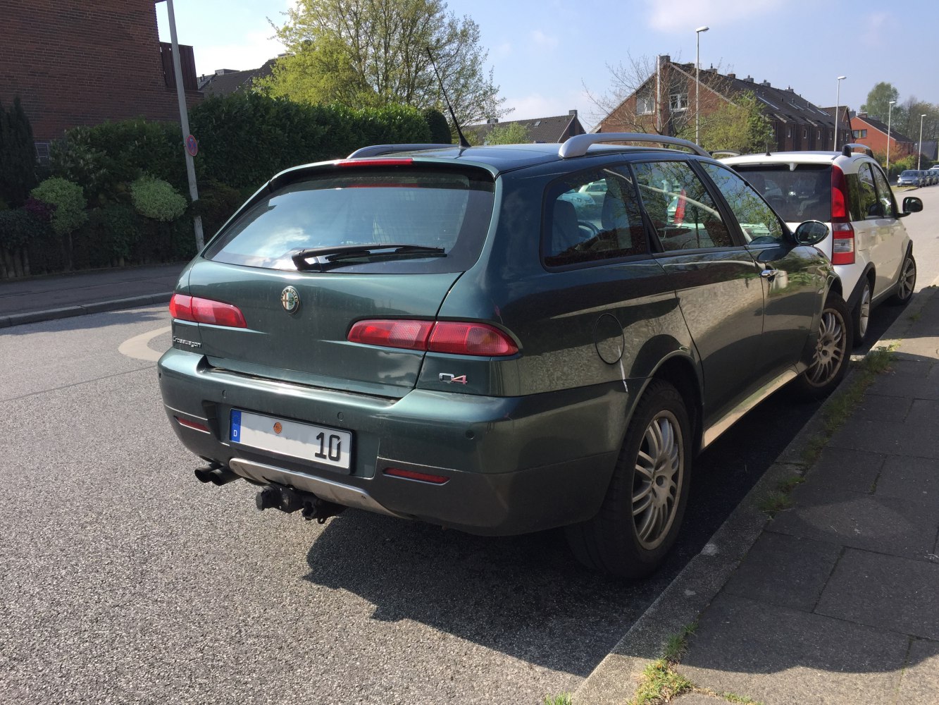 Rear view of estate car with roof rails and tow hitch
