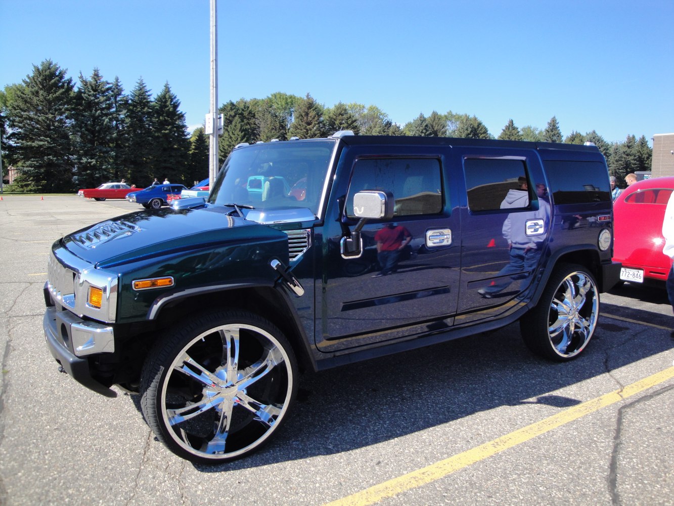 SUV with large chrome wheels and tinted windows