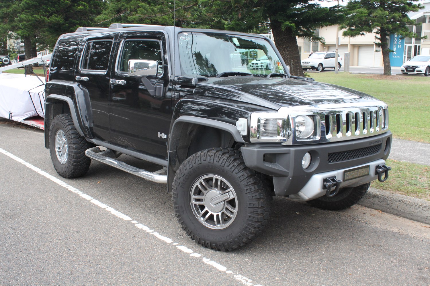 Black SUV with off-road tires and rugged fender flares