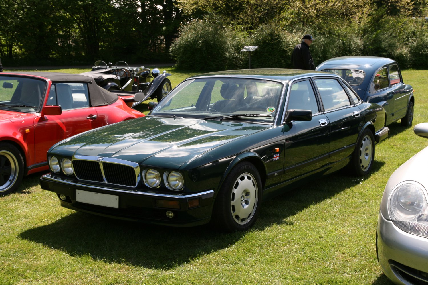 Classic luxury sedan with quad headlights and chrome grille