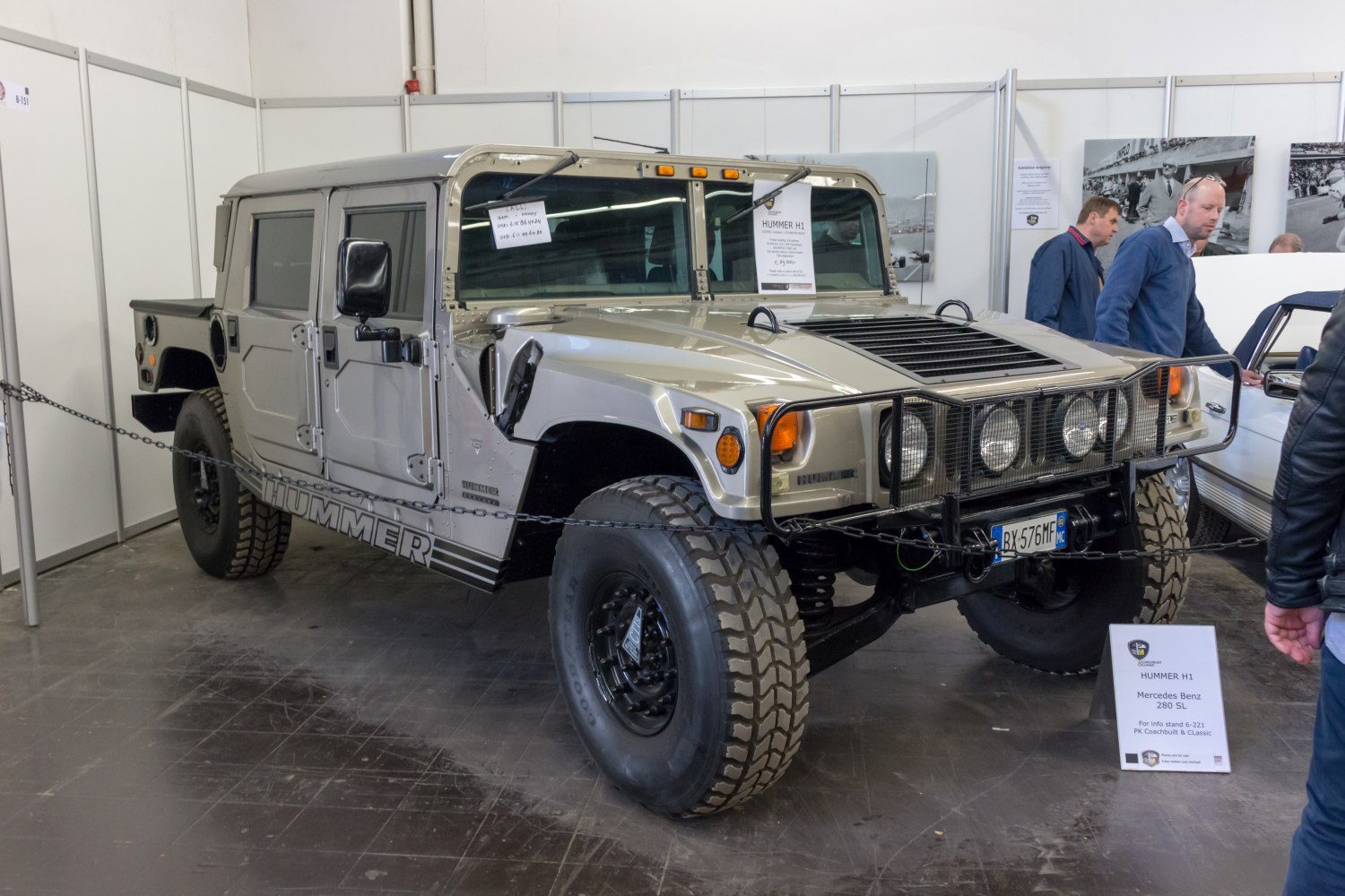 Military-style SUV with heavy-duty grille and large off-road tires
