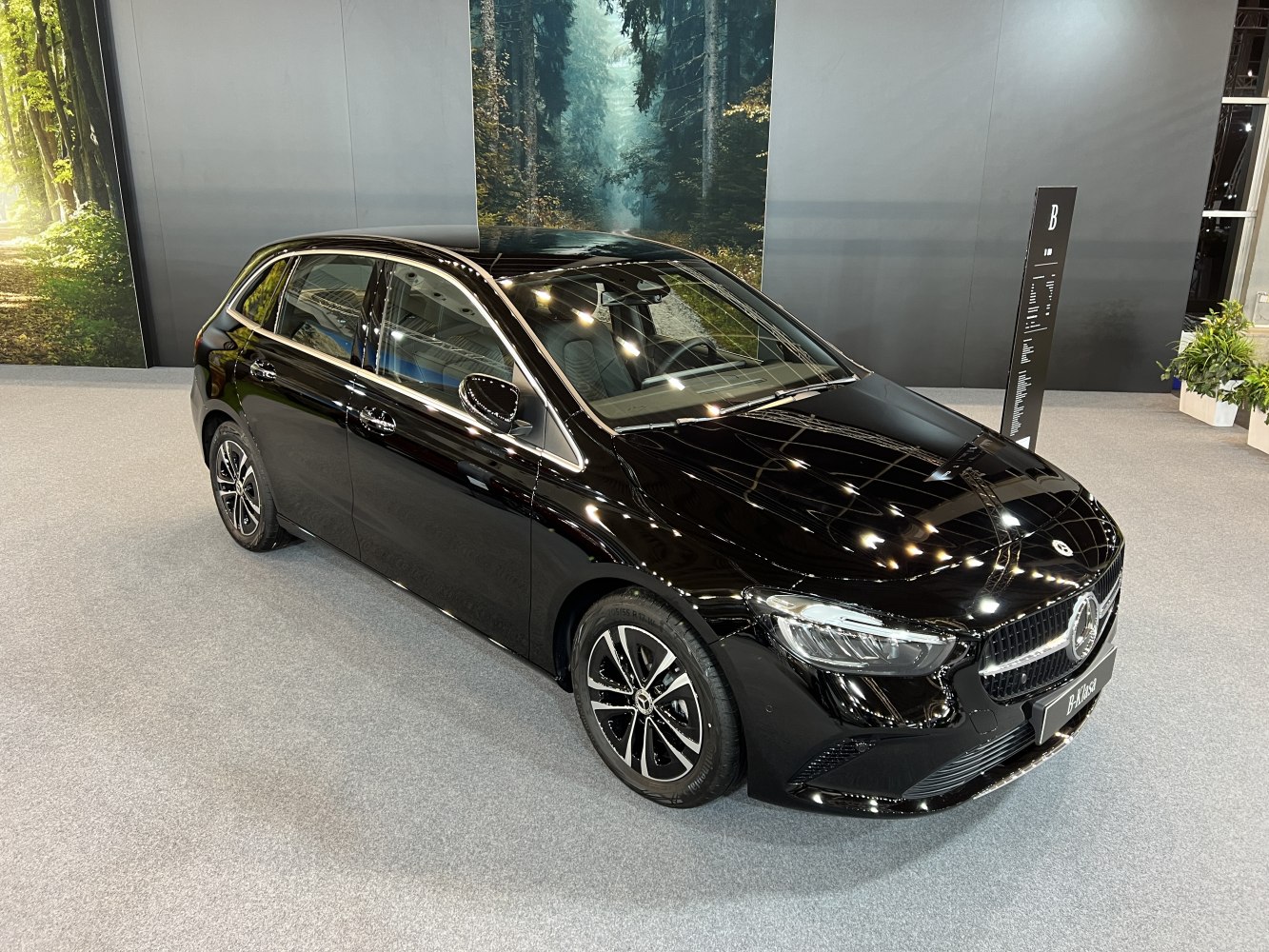 Sleek black hatchback with updated grille and LED headlights