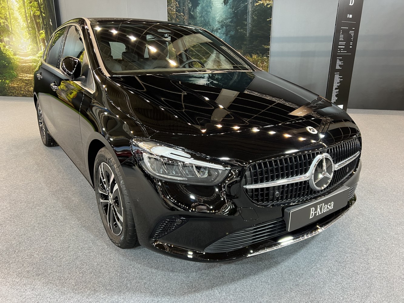 Black car front with grille and LED headlights