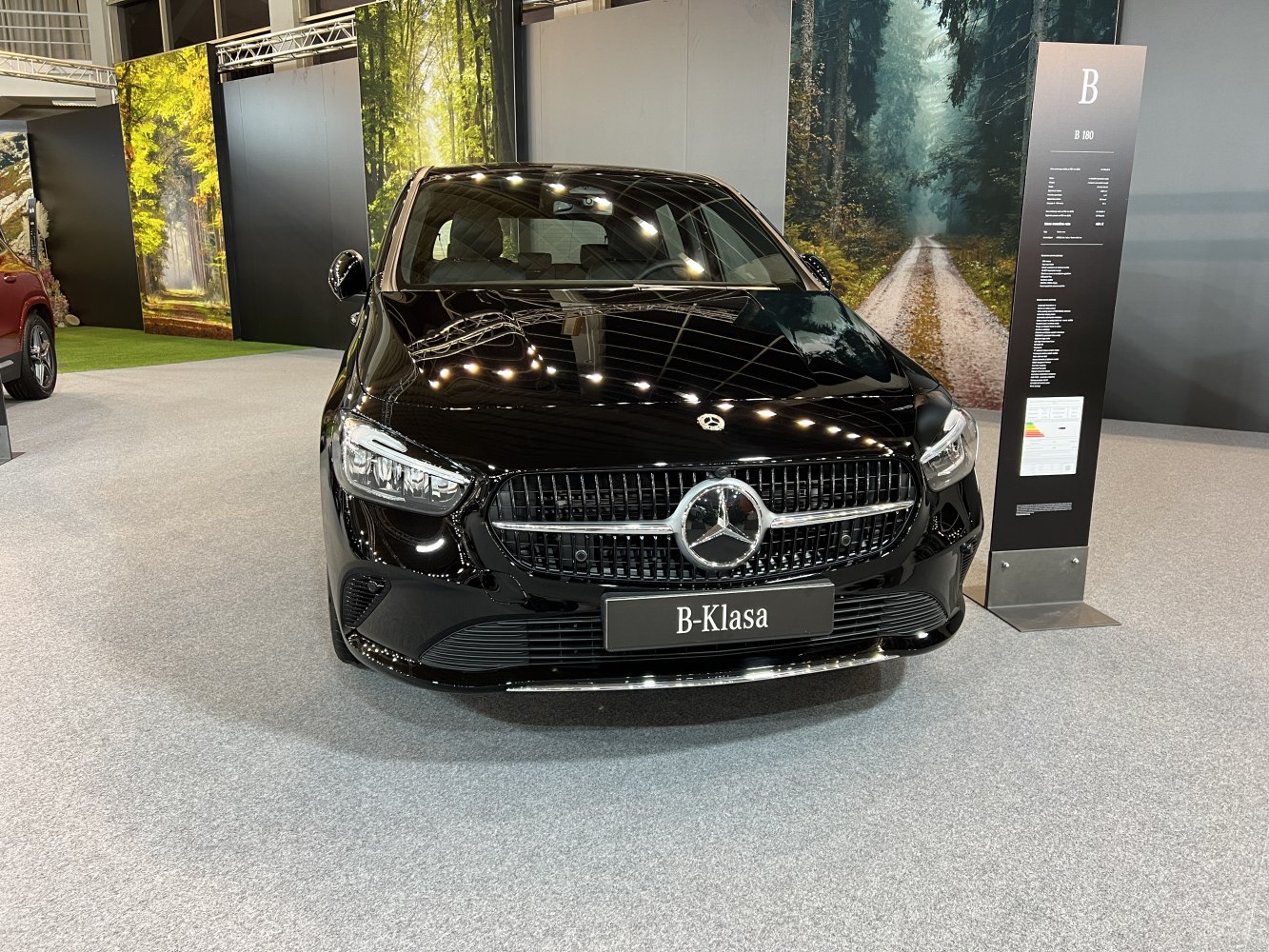 Sleek front grille and LED headlights of modern compact hatchback