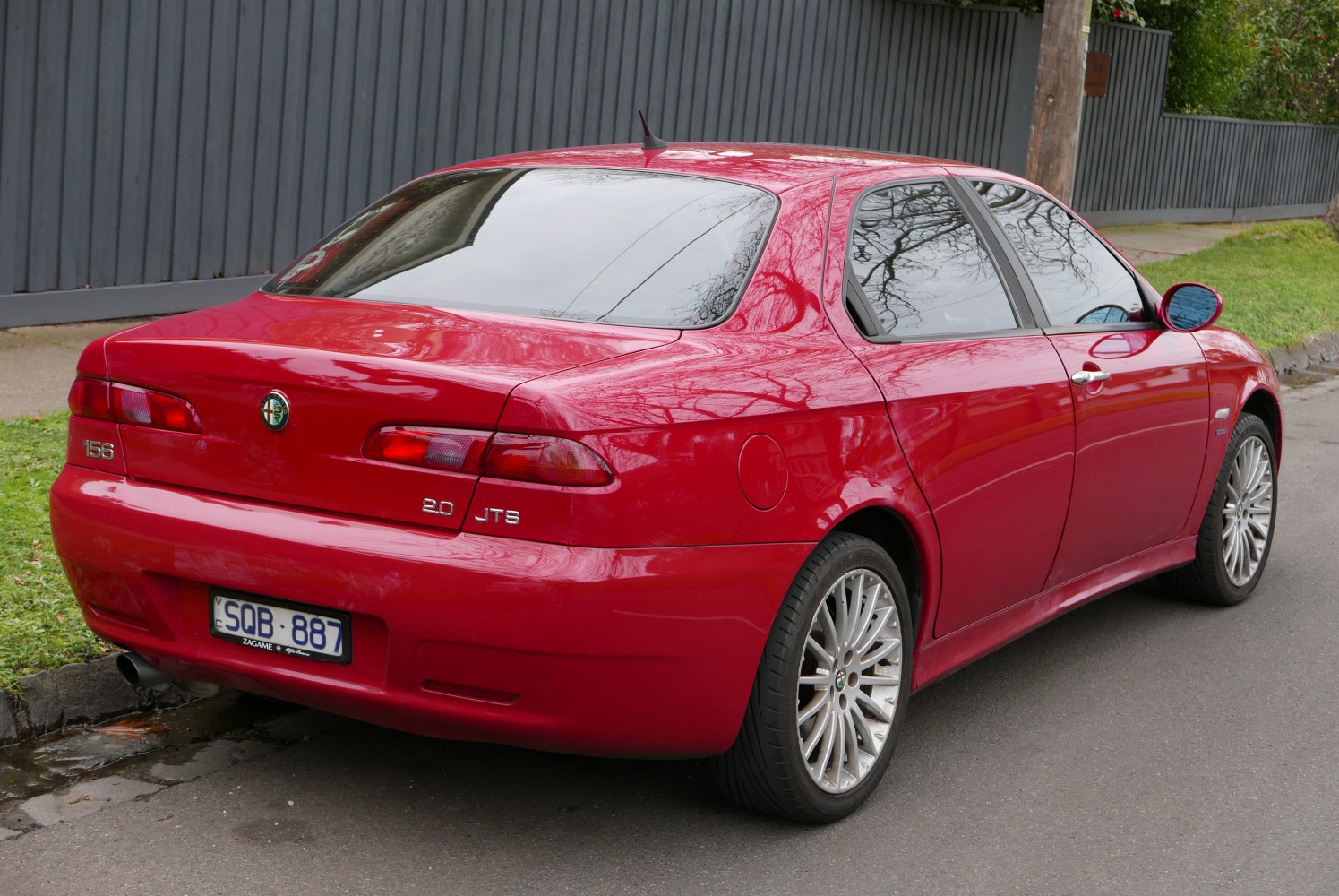 Rear view of sedan with distinctive taillights and 2.0 JTS badge