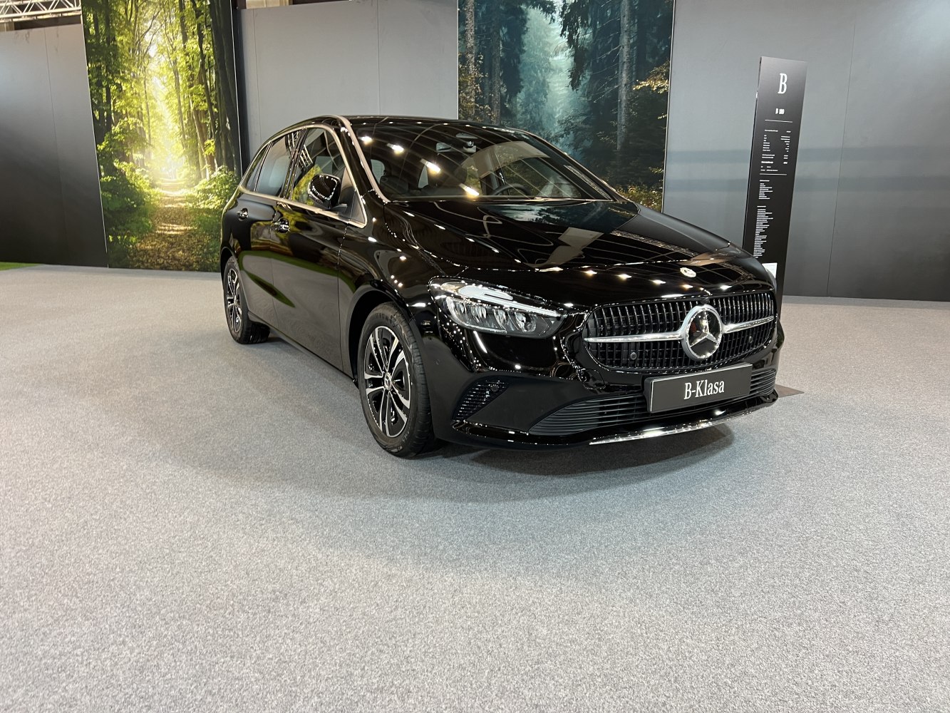 Black luxury hatchback with LED headlights and prominent grille