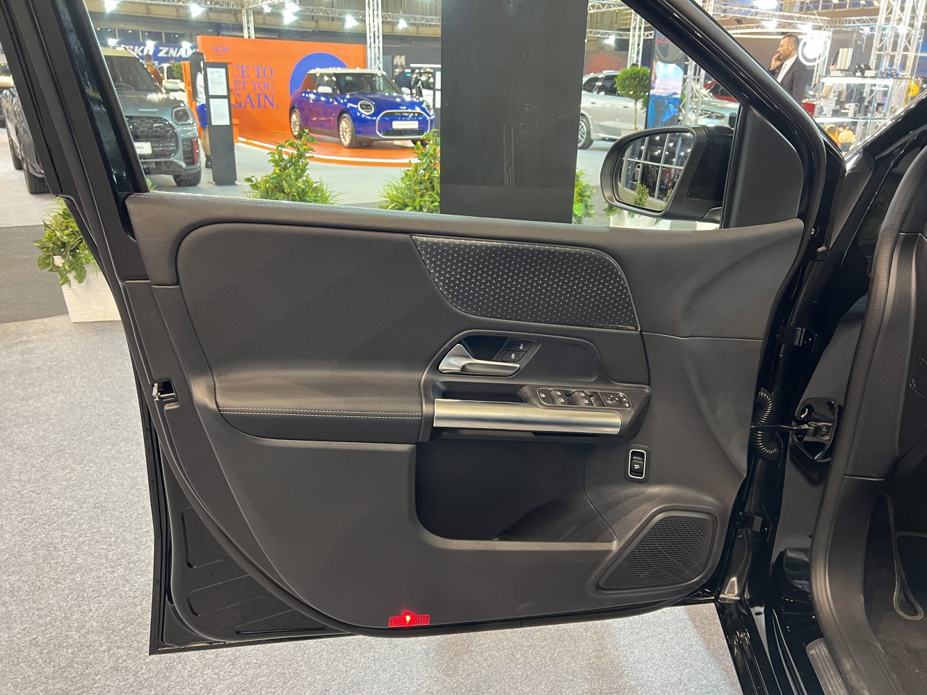 Interior door panel with controls and trim
