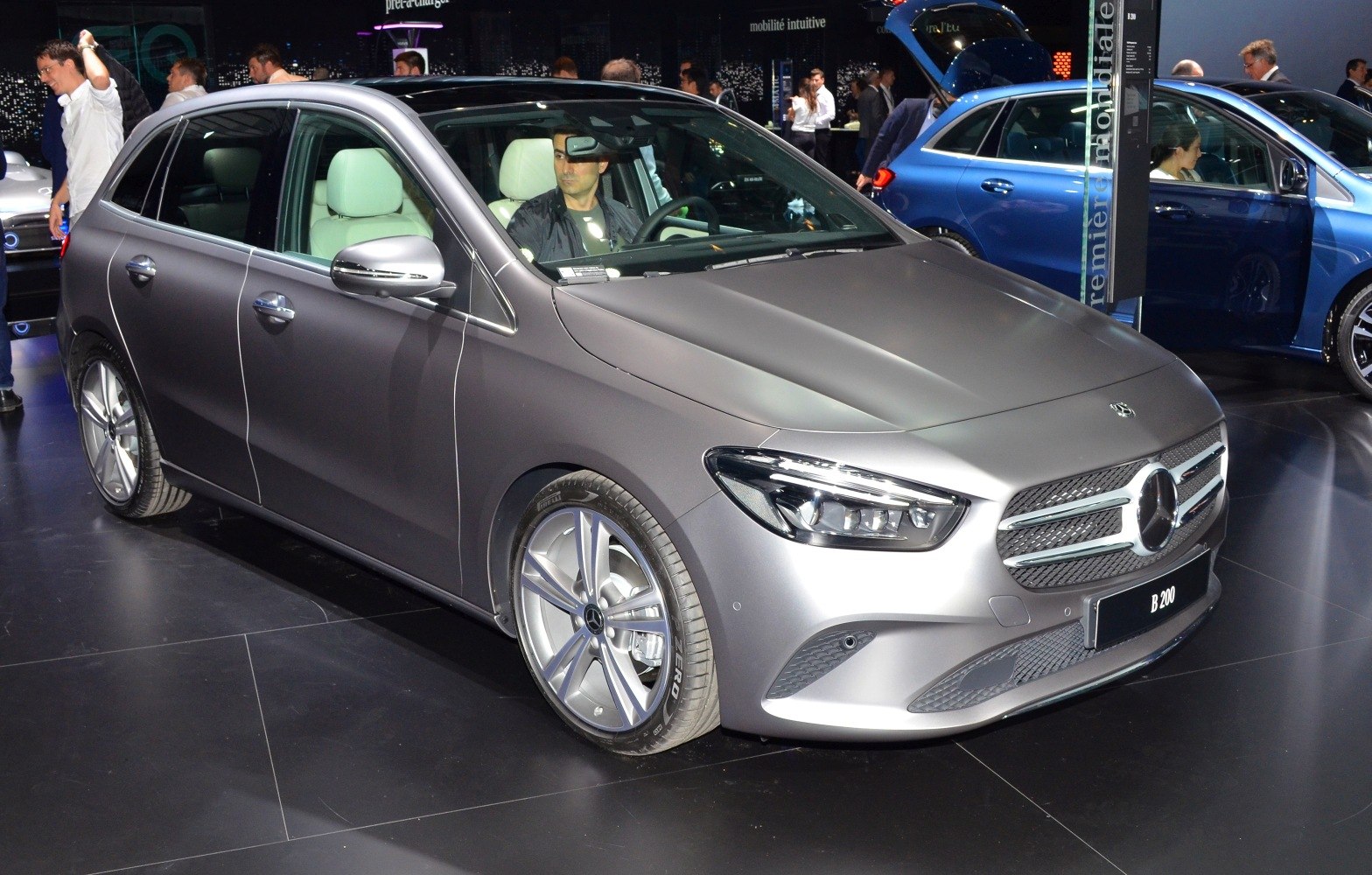 Front and side view of a modern hatchback with LED headlights and prominent grille