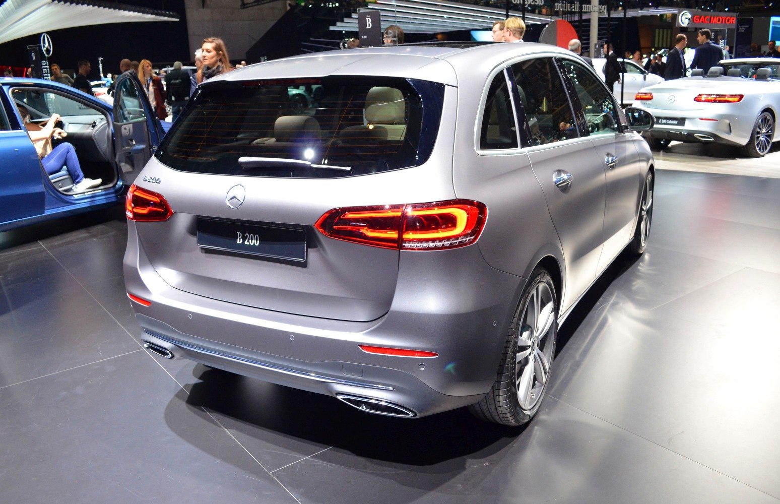 Rear view with sleek tail lights and dual exhaust tips.