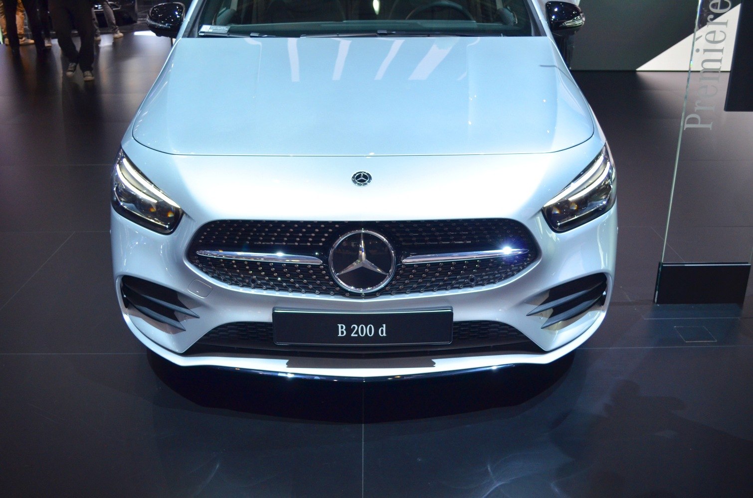 Front view with grille and LED headlights.