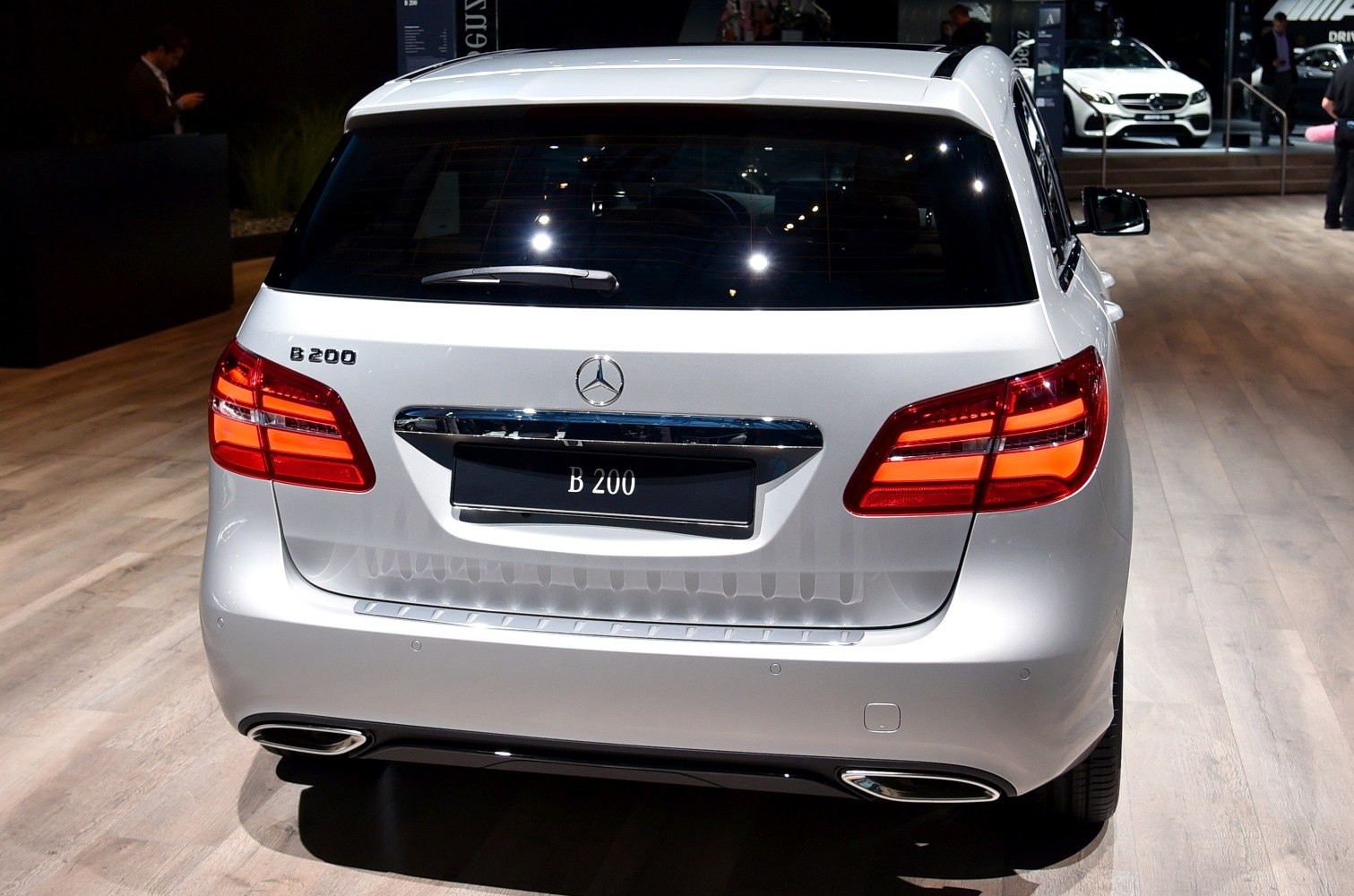 Rear view with illuminated LED tail lights and chrome trim