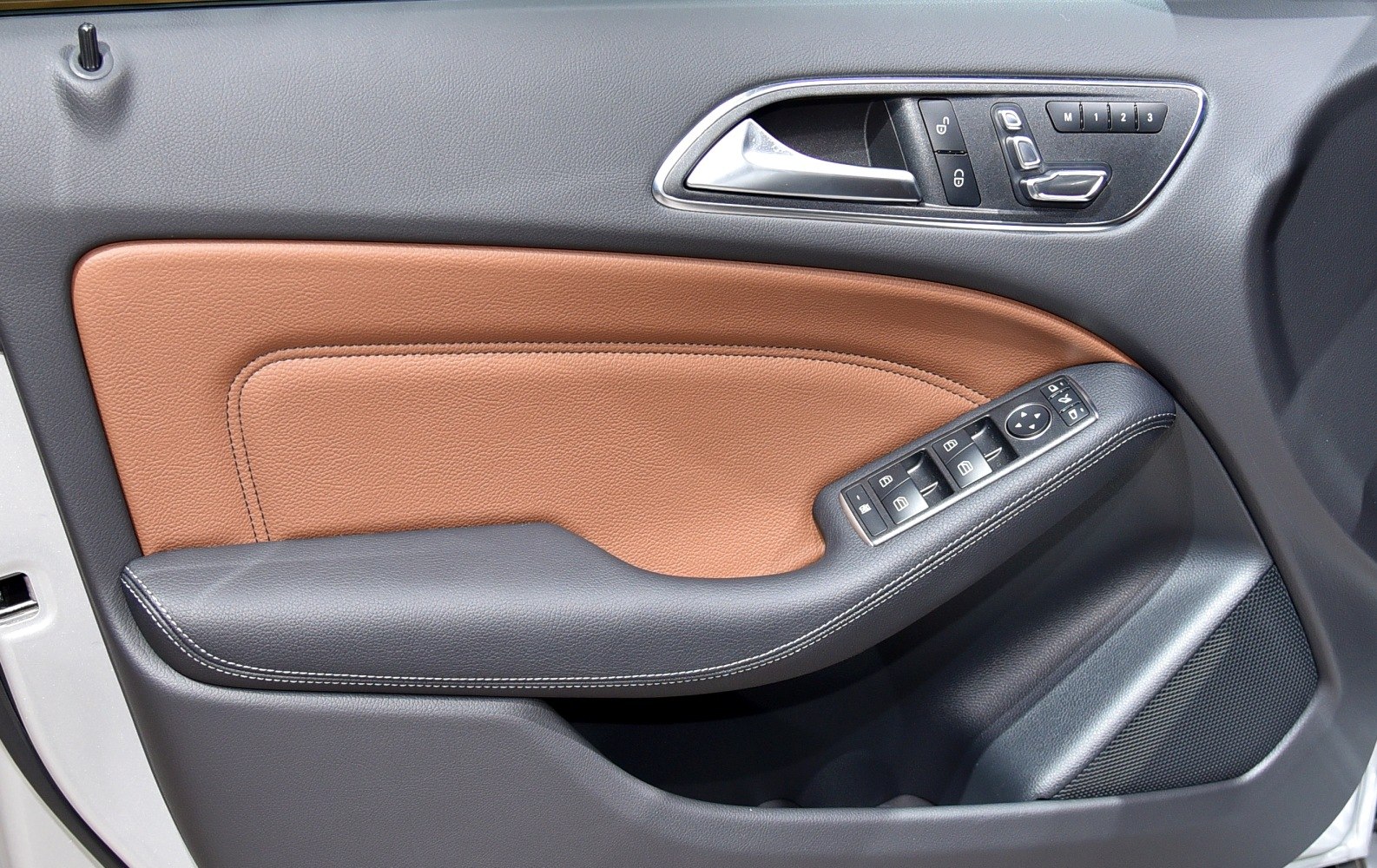 Interior door panel with leather trim and control buttons
