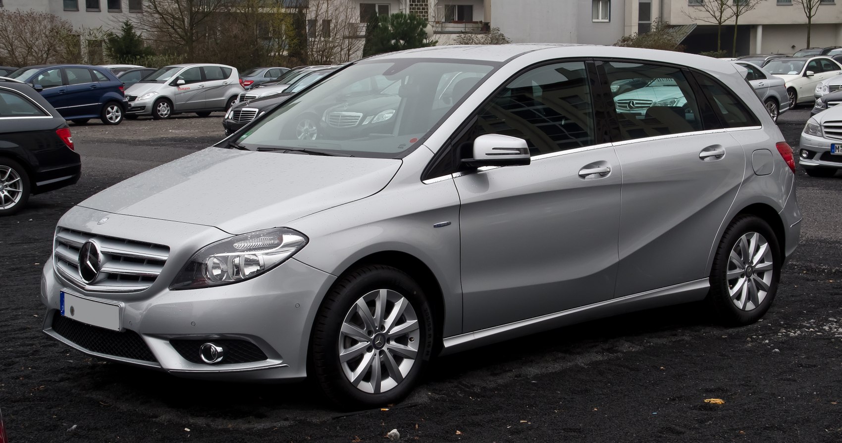 Silver compact hatchback with modern headlights and alloy wheels