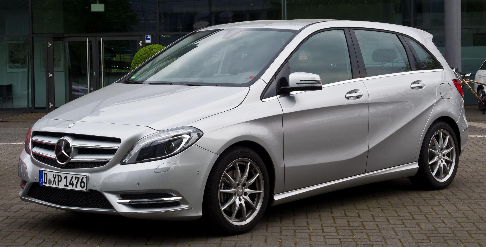 Silver hatchback with front headlight and alloy wheels