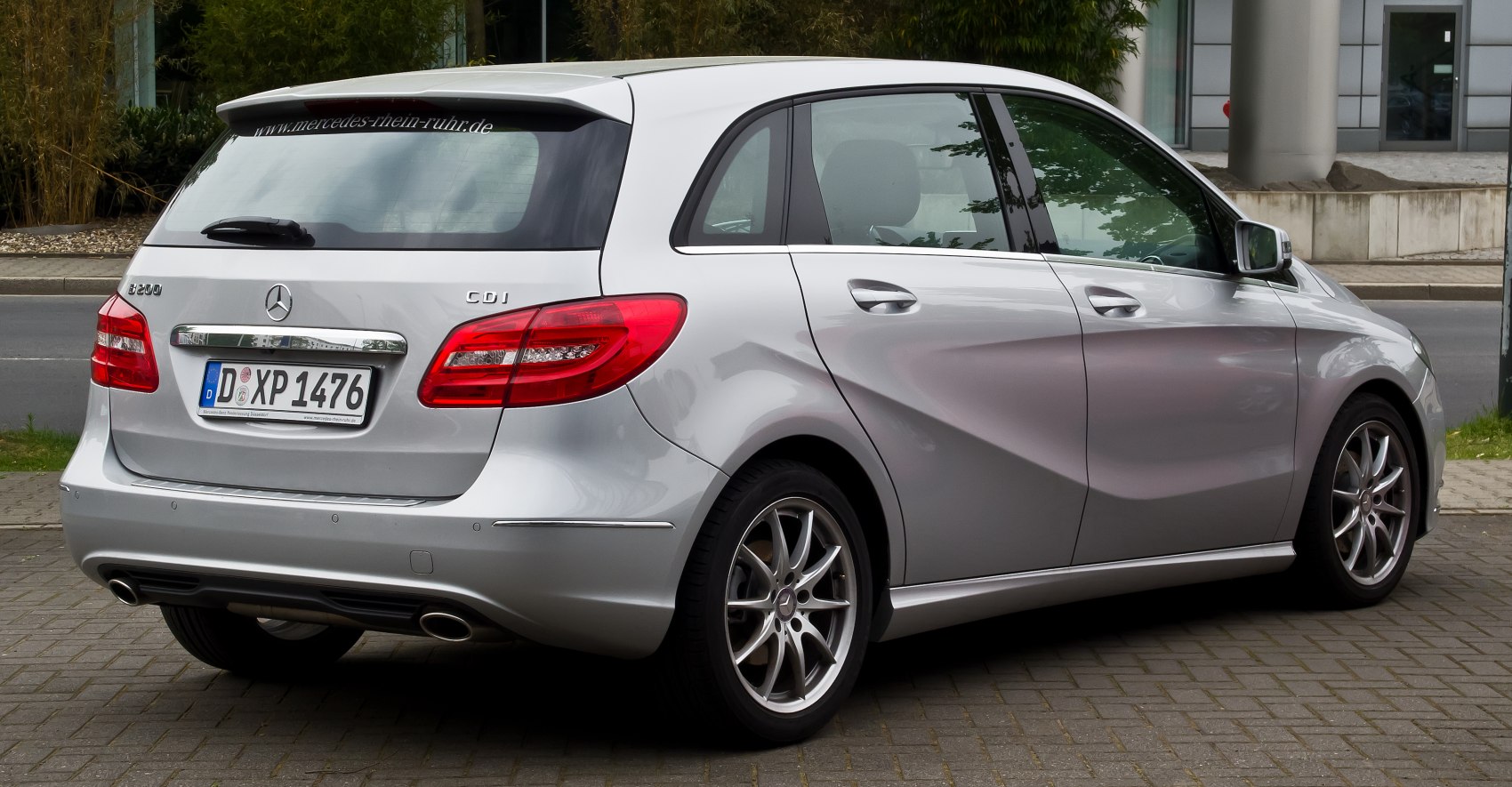 Rear and side view of silver hatchback with alloy wheels
