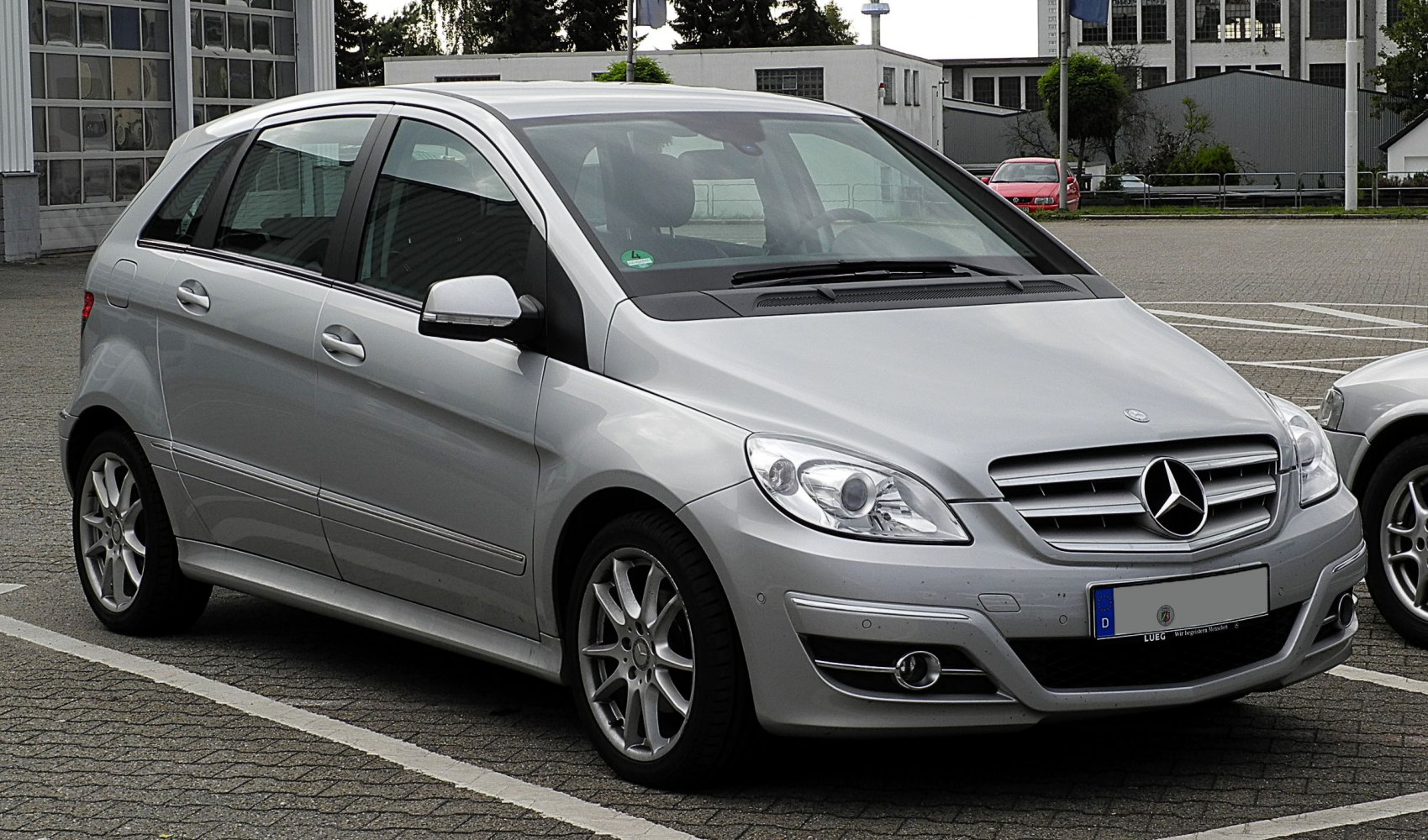 Silver compact hatchback with updated grille and alloy wheels.