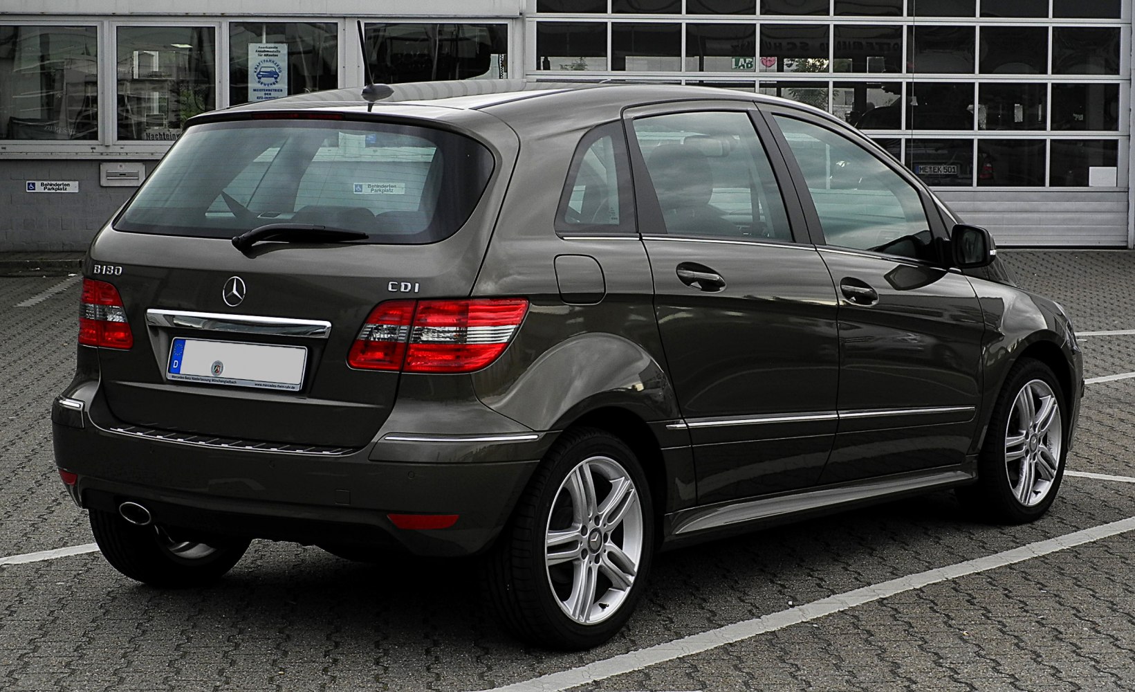 Rear side view with taillights and alloy wheels