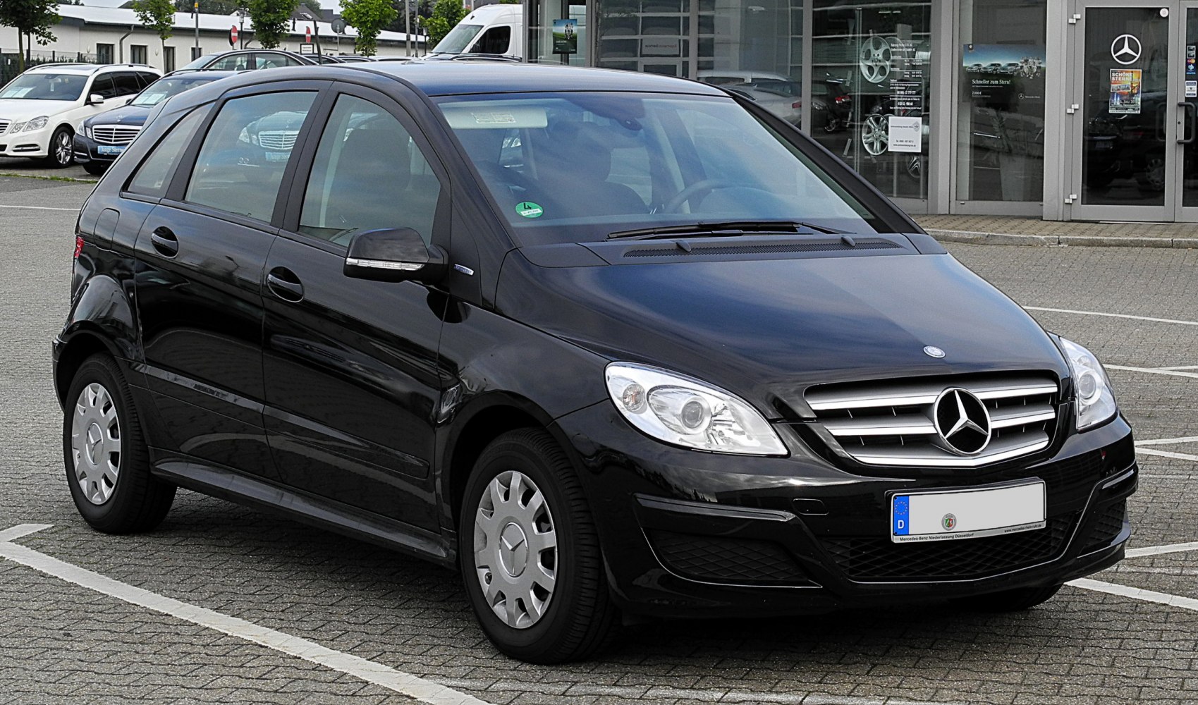 Front and side view of compact hatchback with characteristic grille and headlights