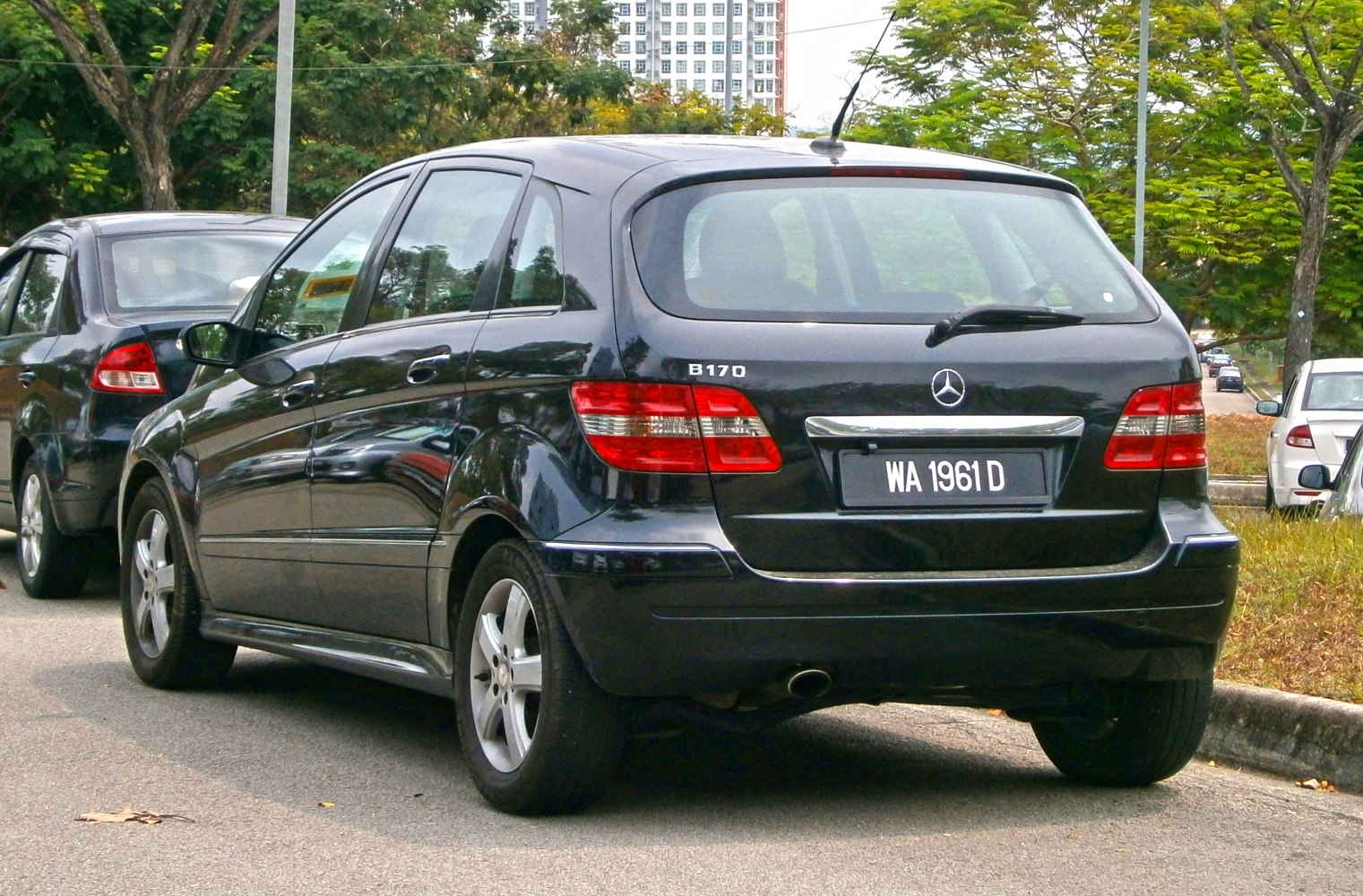Rear view of a hatchback with tail lights and rear windshield wiper