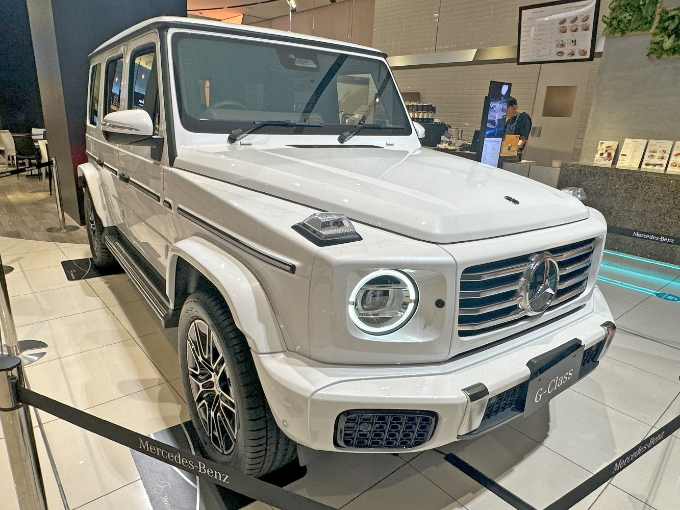 Front and side view of luxury white SUV with LED headlights