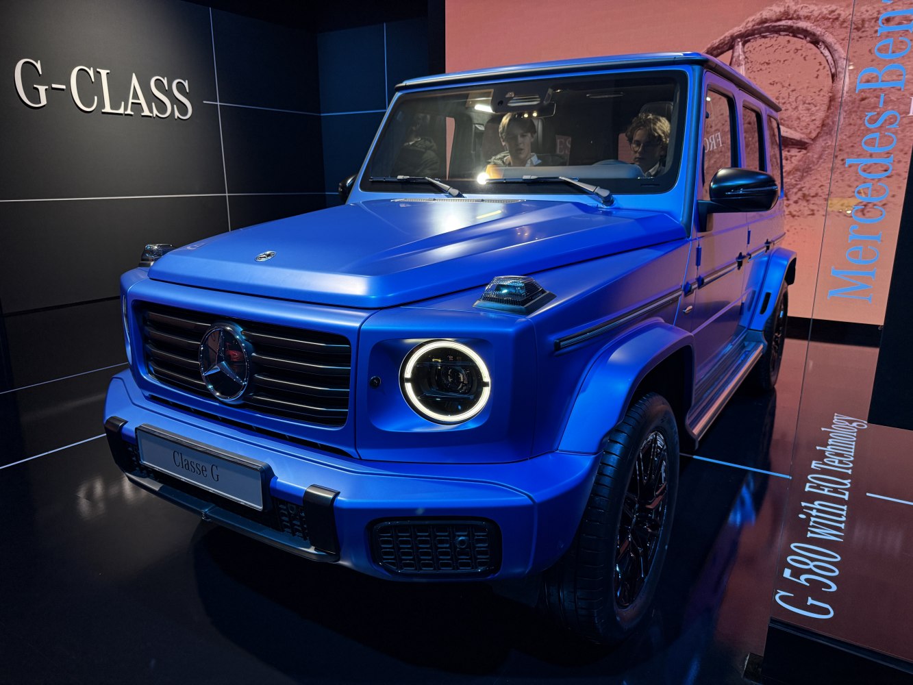 Front view with round LED headlights and prominent grille