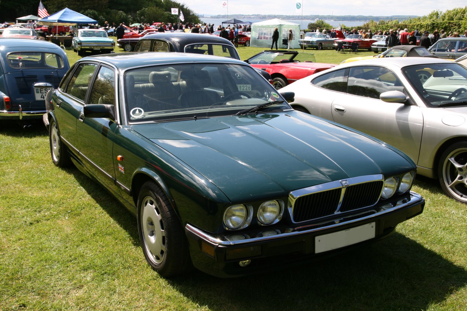 Classic 1980s sedan with quad round headlights and chrome grille