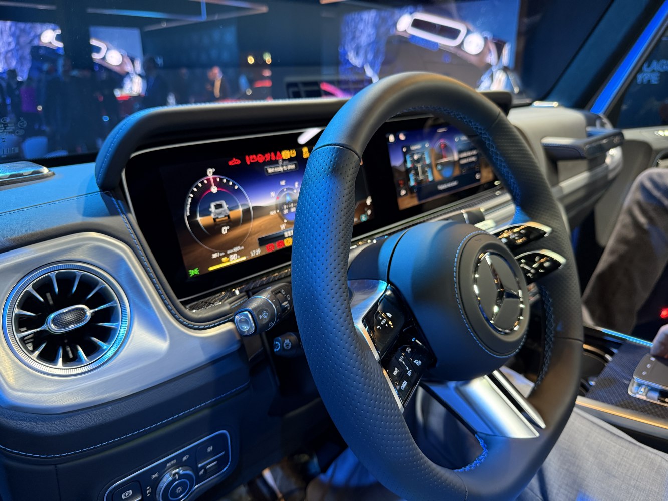 Digital instrument cluster and luxury steering wheel in a modern SUV interior