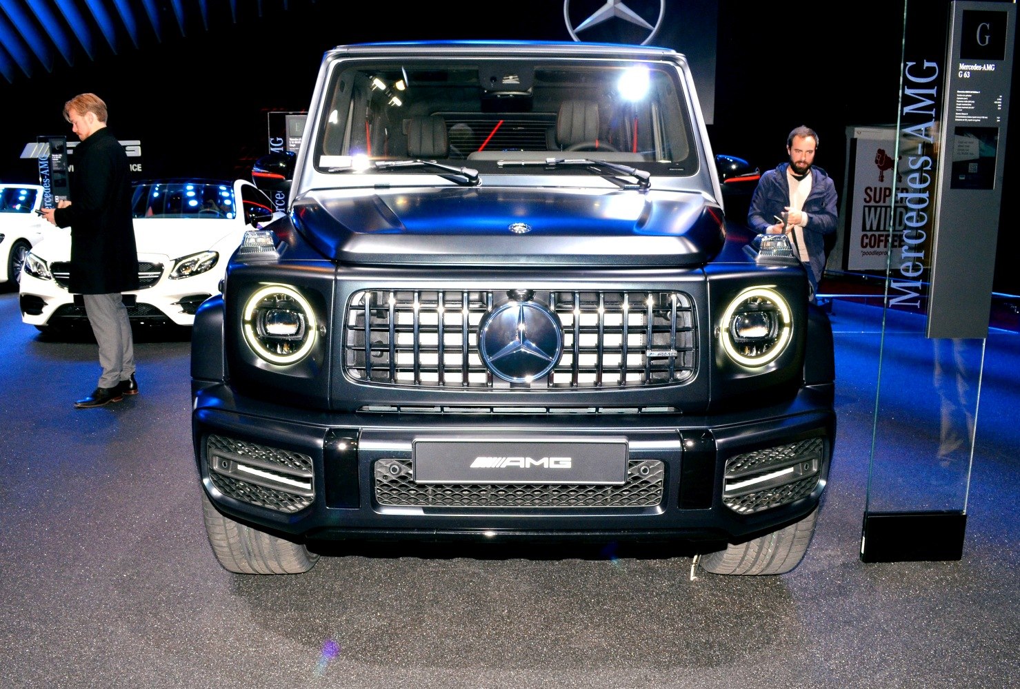 Front view with distinctive grille and round LED headlights.