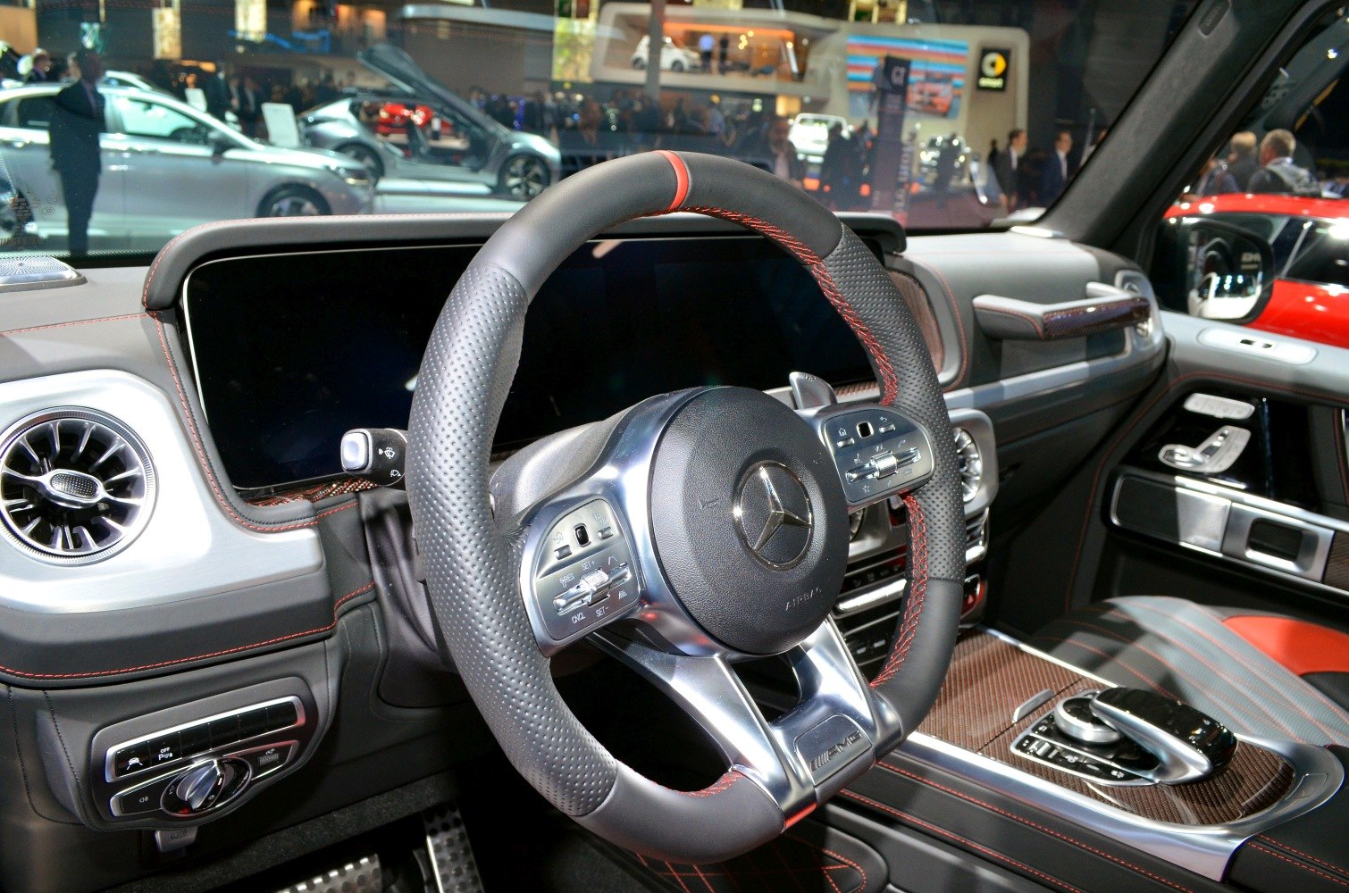 Luxury SUV interior with advanced steering wheel and digital dashboard