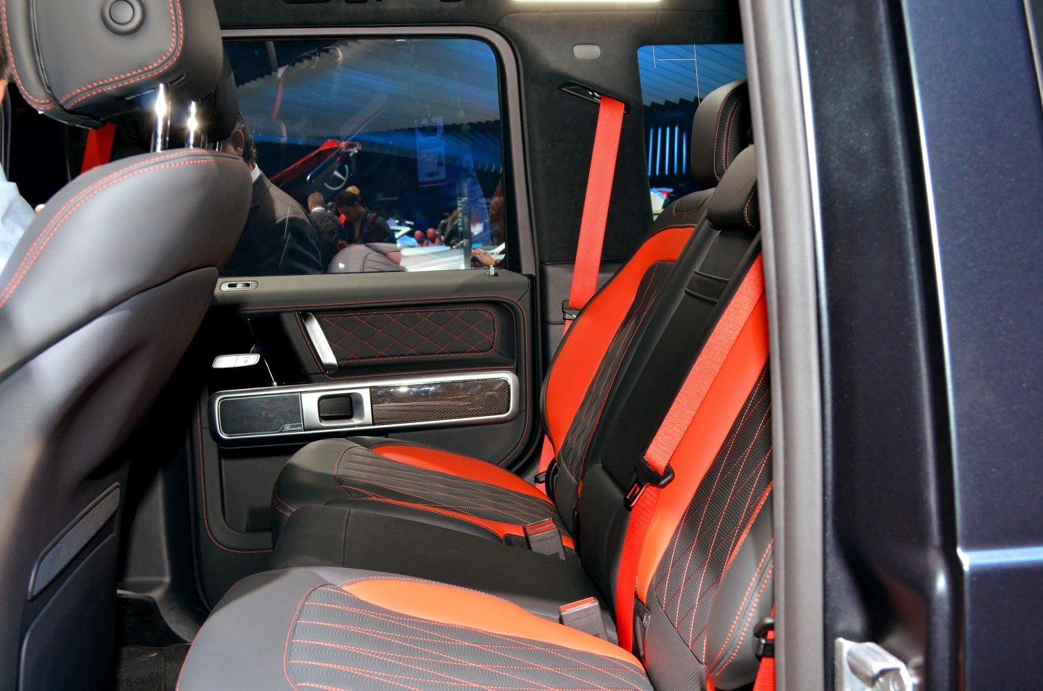 Rear seating with accented red leather and detailed stitching