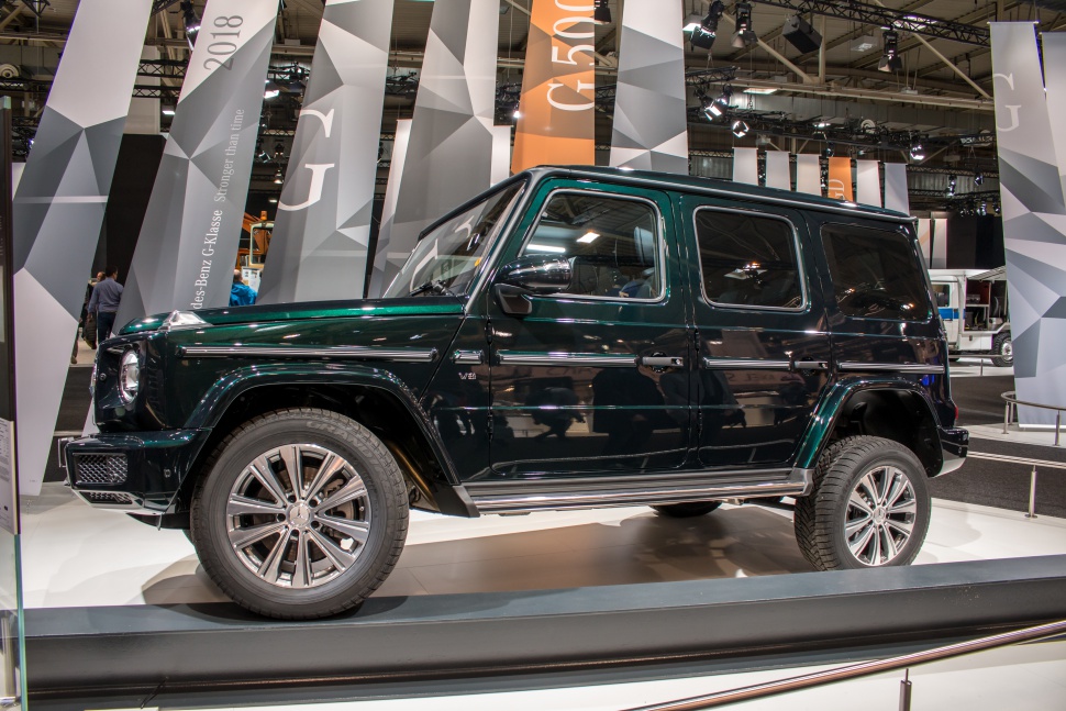 Side profile of a luxury off-road SUV with V8 badge and alloy wheels