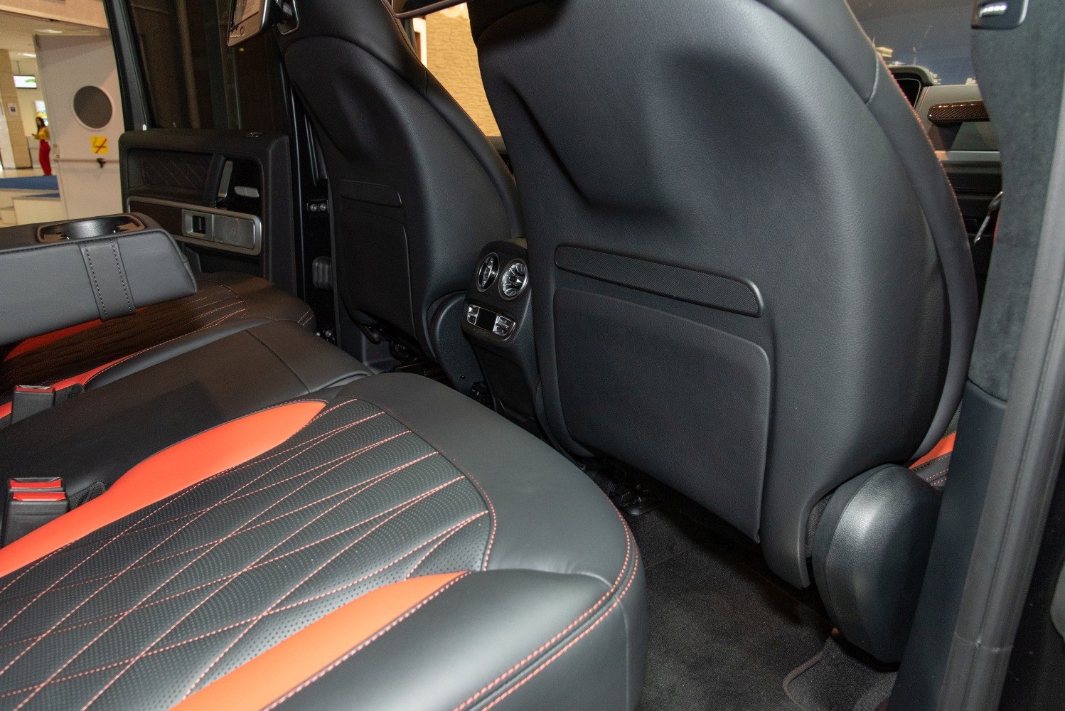 Quilted black and orange leather rear seats with rear air vents